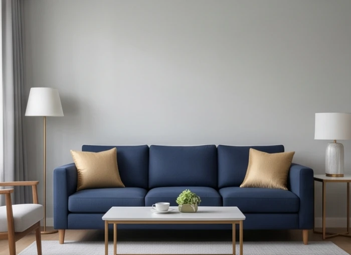 Phòng khách áp dụng công thức phối màu 60-30-10 với tường xám, sofa xanh dương và gối tựa vàng nhạt